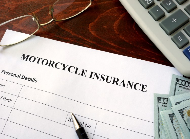 Motorcycle insurance form with detailed coverage options and policy terms in Natick, MA